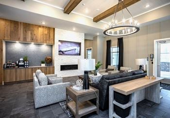 Clubroom with seating areas, computer workspaces, and coffee bar with refreshments
